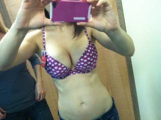 Trying on a new bra with a friend & hubby approves. (Bra has slices of cake/pie on it) lol