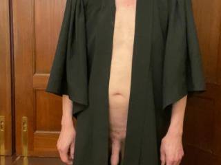 It looks like Sir forgot that he should wear something under the gown and not just the gown..