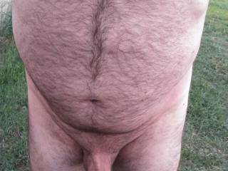 Enjoying the warm weather while naked.