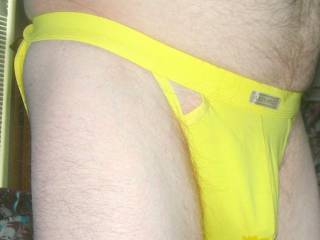 A side/frontal view of my yellow undie with a wet spot as I stand... late April 2024. Coolpix S4 camera was used.