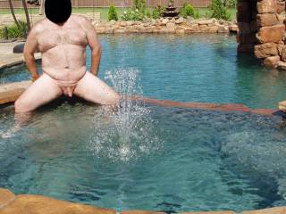 Hubby in our pool, just like I like to keep him...NUDE!  Wanna get wet with him?