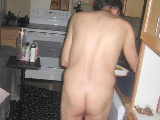 A partial body view that includes my butt as I stand not far the microwave & holding a food tray... Late April 2025. One of the S70 camera`s was used.