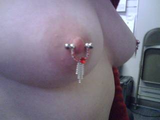 Love your nipple piercings and nice titties baby!