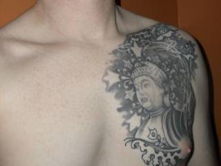 My Buddhist tattoo. I have another Buddha tattoo just below this one.