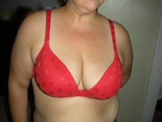 My wife\'s wonder breast in a stunning red VS bra.  What do you think?