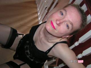 In my new black lingerie, compliments my lipstick don't you think?