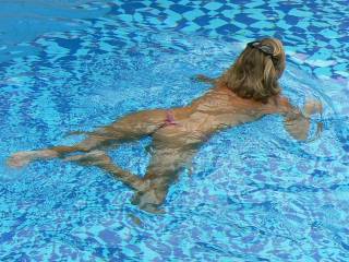 The only thing sexier than a half naked woman in the pool would be a naked woman inthe pool!  Very hot keep it up sexy.