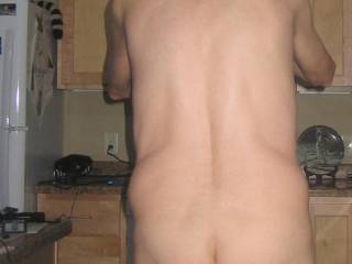 A partial view of my body that includes my butt with my balls barely visible as I stand in my kitchen...September 2025. 1 of 3 S70 camera`s was used.
