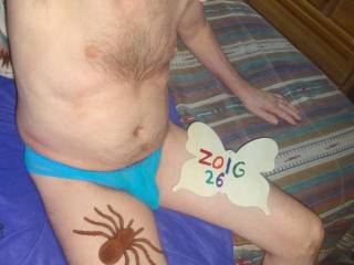 A partial body scene of me wearing my undie as I sit on the bed. A WX Sony camera was used.