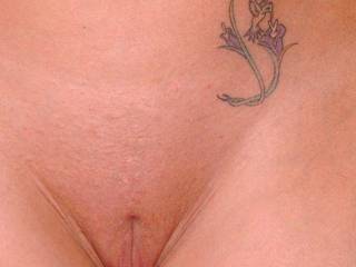 Stunning pussy pic..love that freshly shaven Slit of yours!!..Tattoo blends in nicely.