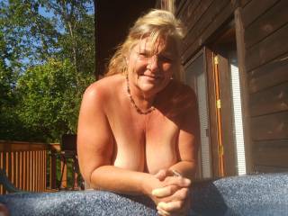 Waiting for him to come out and give me a good work over on the side of the hot tub outside