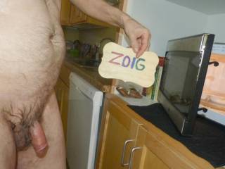 A side standing frontal near an open microwave door... FZ150 camera was used.