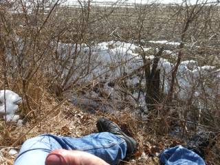 I was walking thru the cold spring and get horny... so i sit down, unzip my jeans and let my cock chillin in the sun...near a hiking path (video soon).