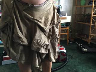 With the vacuum cleaner ready behind her, the maid stands with shoes off on the dirty carpet. Asking - please sir, it is a warm afternoon, so may I clean the room with my tits out? Permission granted - now bare-breasted and bare-footed ...