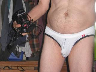 A frontal standing scene wearing my undie and holding a camera...September 2025. 1 of 3 S70 camera`s was used.