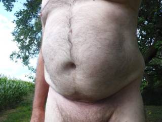 Naked outdoors showing my uncut cock.