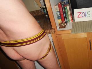 My butt as I am wearing my bottomless undie as I stand near my microwave where I have some old books...Sony 150 camera was used.
