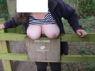 'Can I move now guys - the sperm is drying quickly, on my big tits, and the wooden sign they are hanging over. Splash some water over them, rub them dry, and go for part two - more over my tits this time, less on the sign'. Perhaps she said ;)