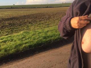 Along a winding country lane - showing her tits to a friend