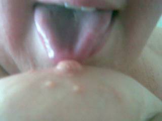 Licking one of my tits.. I\'m a talented girl ;)