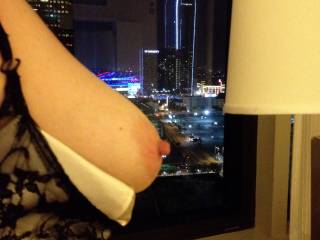 View of her tits in the hotel window