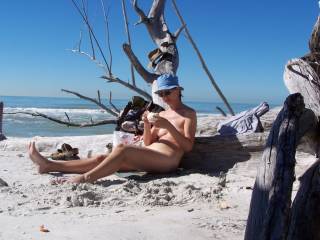 nude women sunbathing on beach