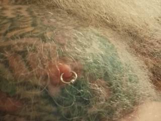 It\'s my tattoo\'d pierced nipple. Needs a pull