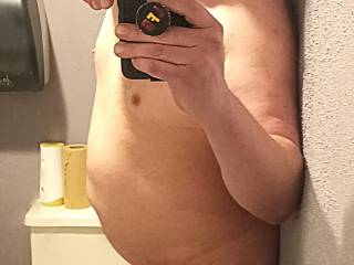 Lee getting naked and showing off in a public bathroom