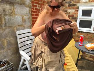 Talking to the neighbour looking over his wall. He says - hey, what is that down your shirt? Right in front of him she she takes her top off and has a look. It\'s dried sperm from last night - two guys took me to a party - you know how it is. Wow, he said!