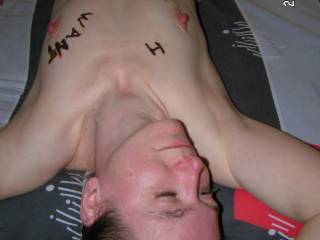 Naked, awaiting a cum shot across the face and chest.