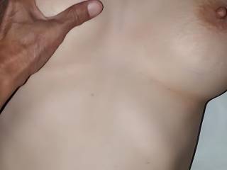 Grabbing her tit while fucking her