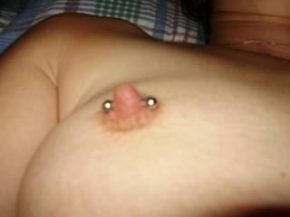 Closeup of her pierced nipple