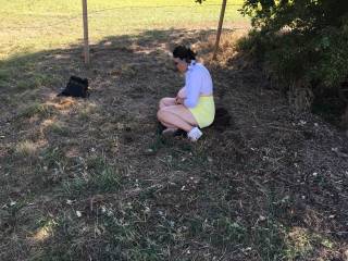 The two guests will see this in a few minutes. My lovely friend sits, tits out, waiting under a tree. Wearing sexy sandals, and just two items to remove to get naked - she gets on all fours and one guest pulls her top off, the other takes her shorts ...