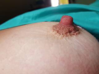 Woke up to the wife\'s nipple hard and sticking out and had to take a picture before I started sucking on it. What would you have done