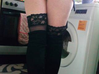 She\'s in her short skirt bent over the washer waiting for cock
