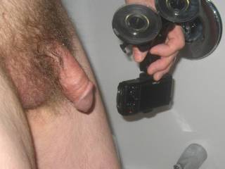 A frontal side close up as I stand after my shower and holding the TG3 camera that`s attached to a suction mount... late April 2025. Canon 630 was used.