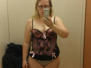Wife trying out new lingerie in a dressing room.