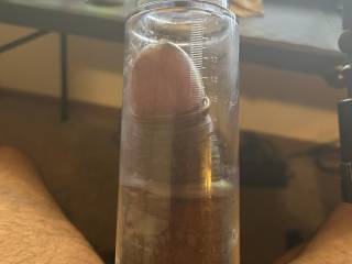 Using a penis pump to get as engorged as possible.