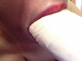 I was away hunting. My wife took this selfie of her sucking a large white dildo.