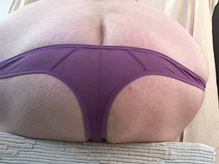 Showing my big bottom in my little purple panties.