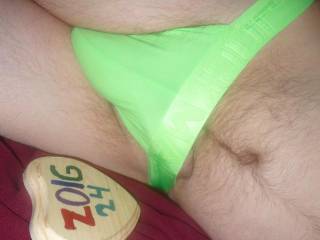 I am in bed wearing a lime undie, and the tip of my erection is barely visible. Z50 camera was used.