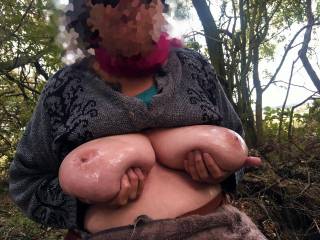 Bright sunshine behind her as she sits waiting on a log, in a small woodland just off a footpath. The guest is due, so she prepared two shiny welcomes
