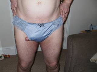 poking out of shiny blue panties