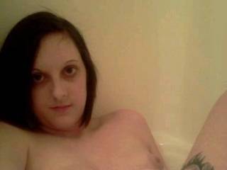 Chelsi topless and posing in the tub