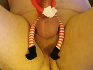 Santa\'s little helper doing his job. The naughty little elf.