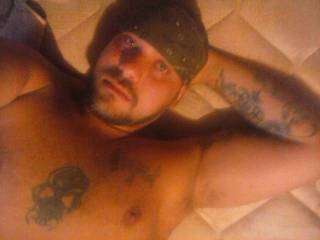 me on bed rubbin cock