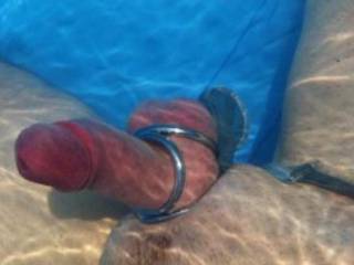 underwater view of my cock wearing this triple cockring. i love to wear it at pool