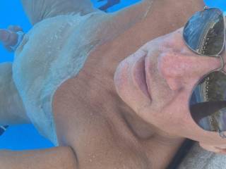 Naked in the pool.
