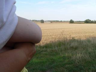 Too far away to see - she flashes her big tits at a worker gathering the harvest