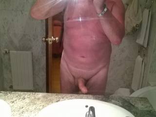 showing the tan off in benidorm hotel bathroom mirror